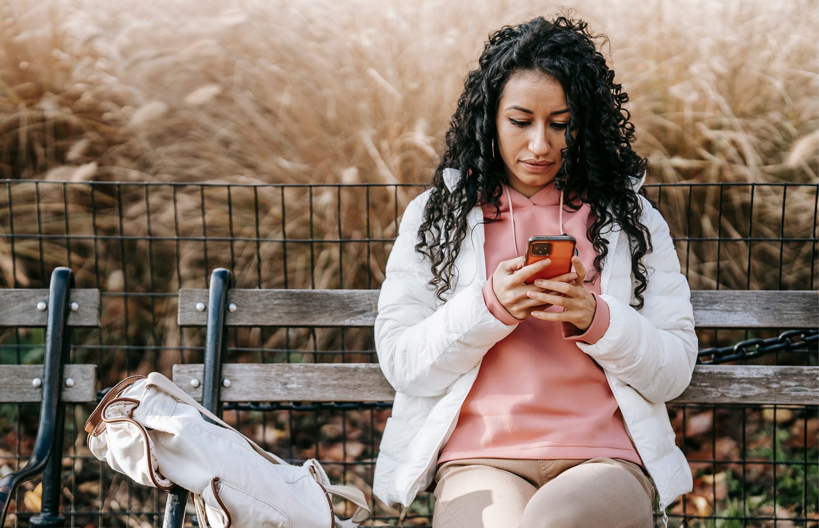 An anxious woman waiting for reassurance and emotional validation in a relationship.