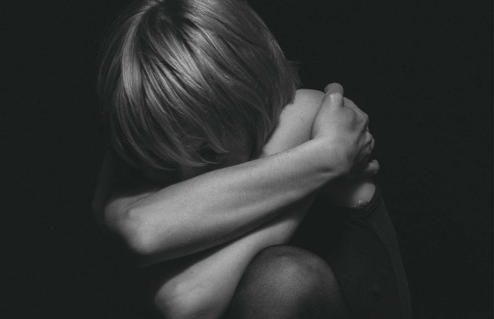 Woman with low self-esteem in relationship struggling with emotional pain and insecurity