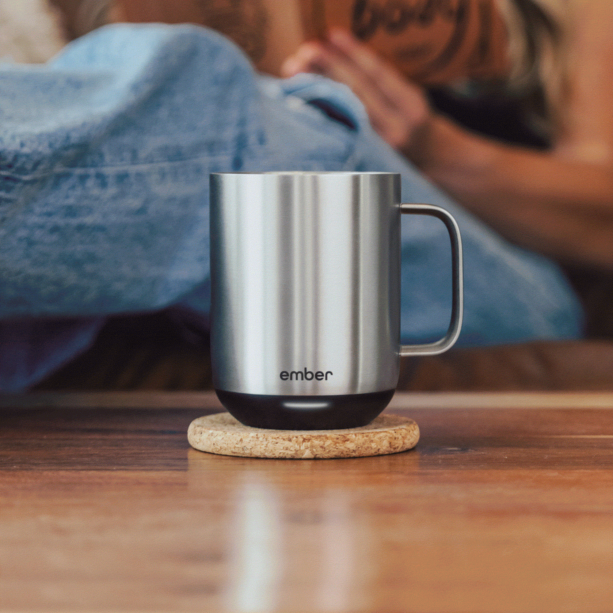 A slideshow of a man places a wallet in a suit pocket, an espresso machine with a filled cup, a man in a gray robe smiles, and a close-up of hands holding a blue can and car keys