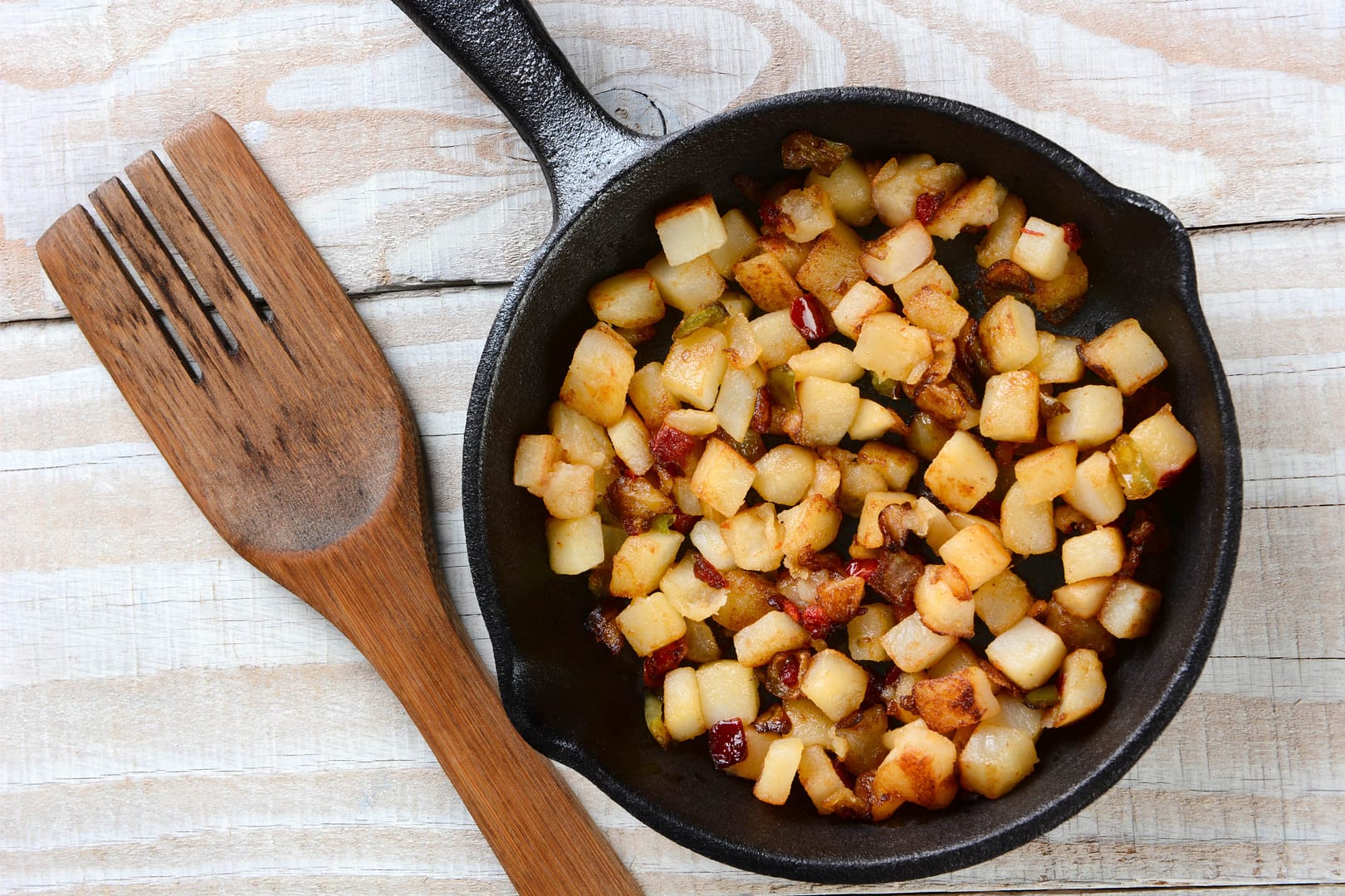 Fried breakfast potatoes on a pan