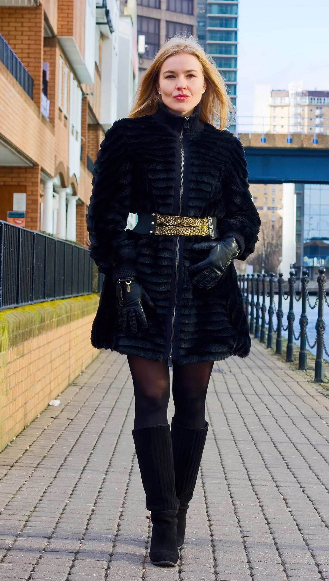 A beautiful Russian girl walking along a path
