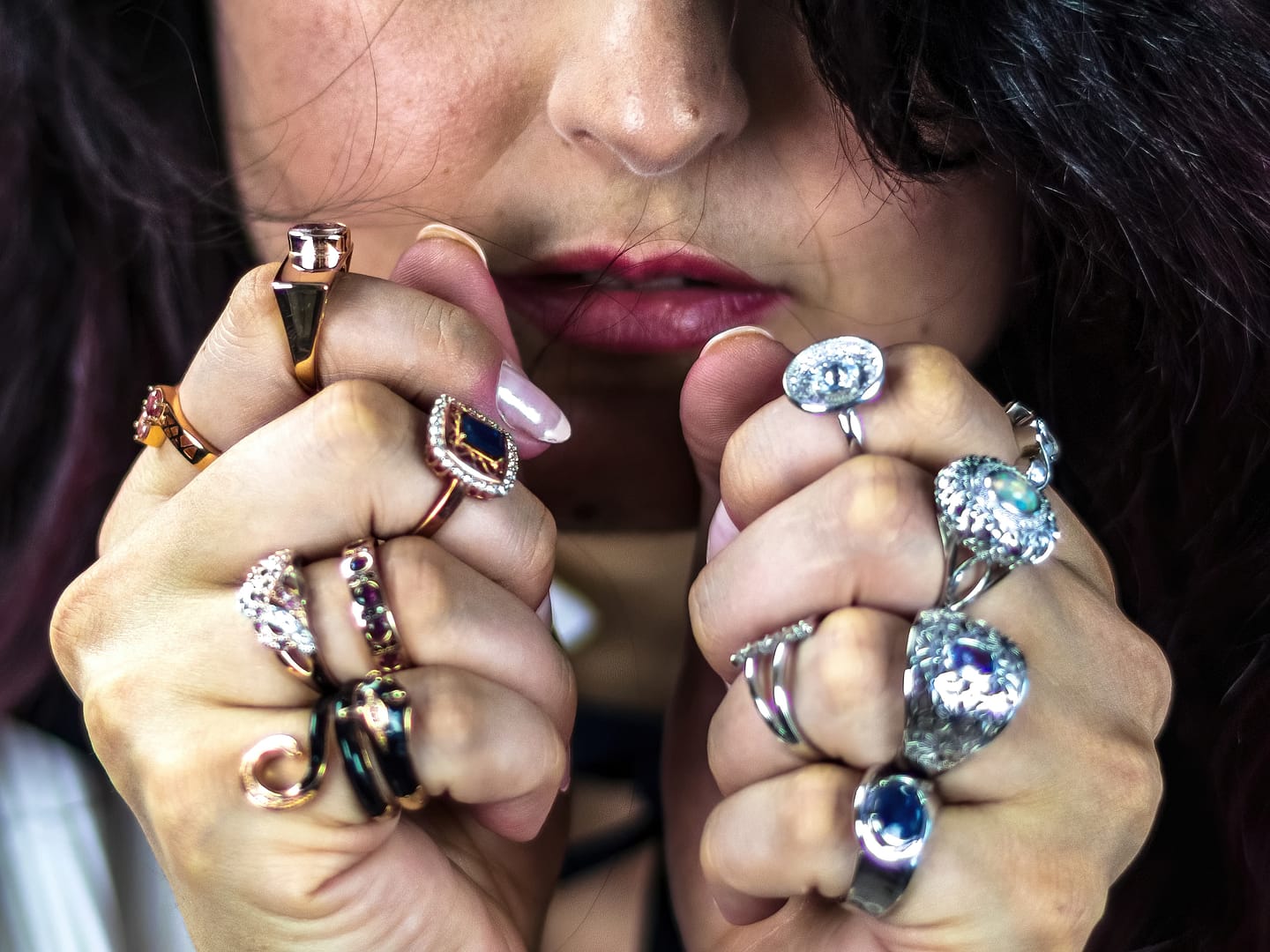 Woman with a lot of different rings around her fingers