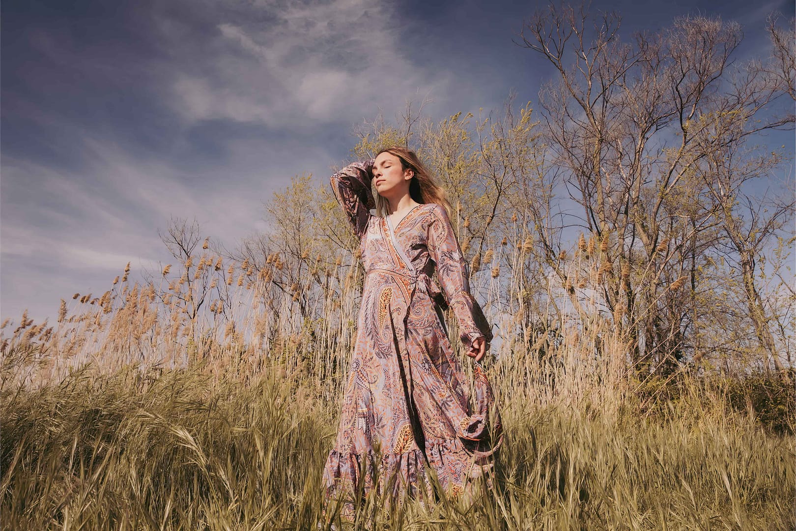 Woman in boho dress standing in the field