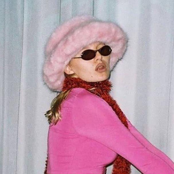 Woman with pink furry bucket hat
