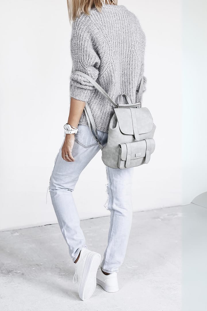 Woman wearing all minimalistic silverish fashion outfit