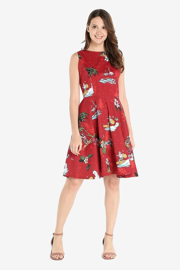 Woman wearing a santa in hawaii flare dress