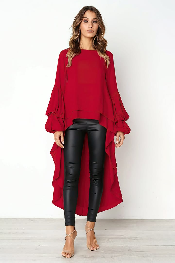 Woman wearing a long lantern asymmetrical blouse