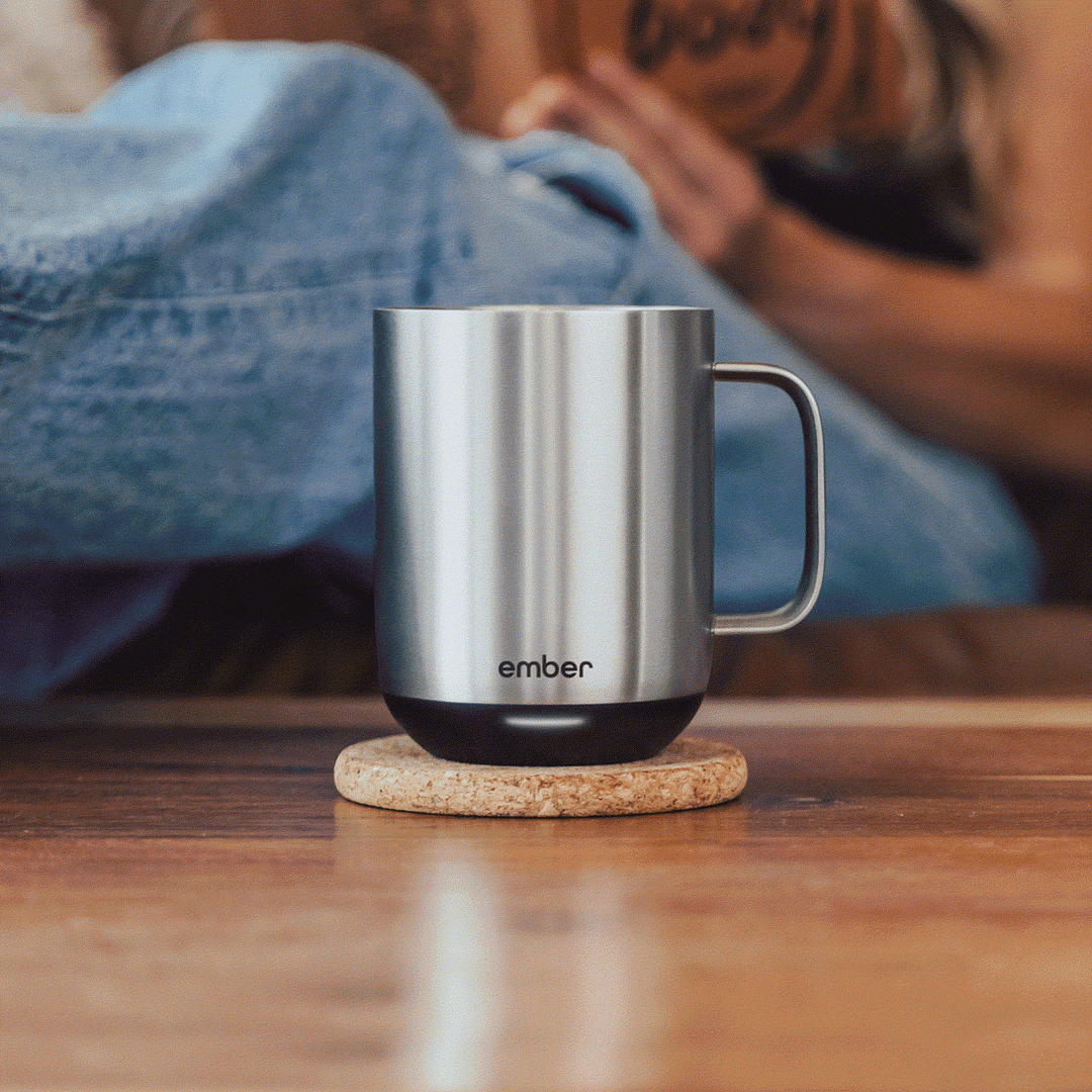 A slideshow of a man places a wallet in a suit pocket, an espresso machine with a filled cup, a man in a gray robe smiles, and a close-up of hands holding a blue can and car keys
