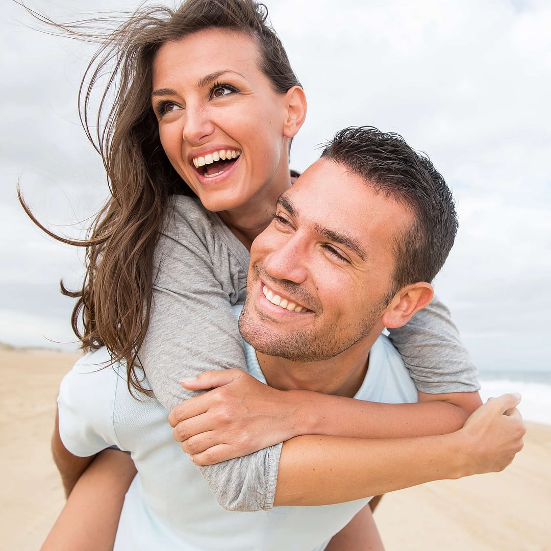 Portrait of living young couple at the beach
