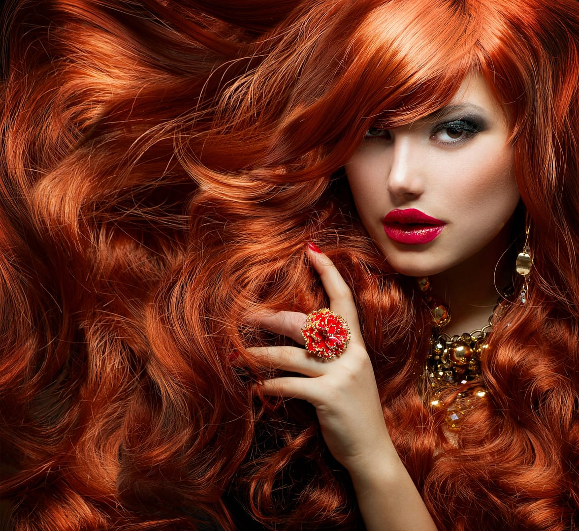Woman with very long and thick red hair