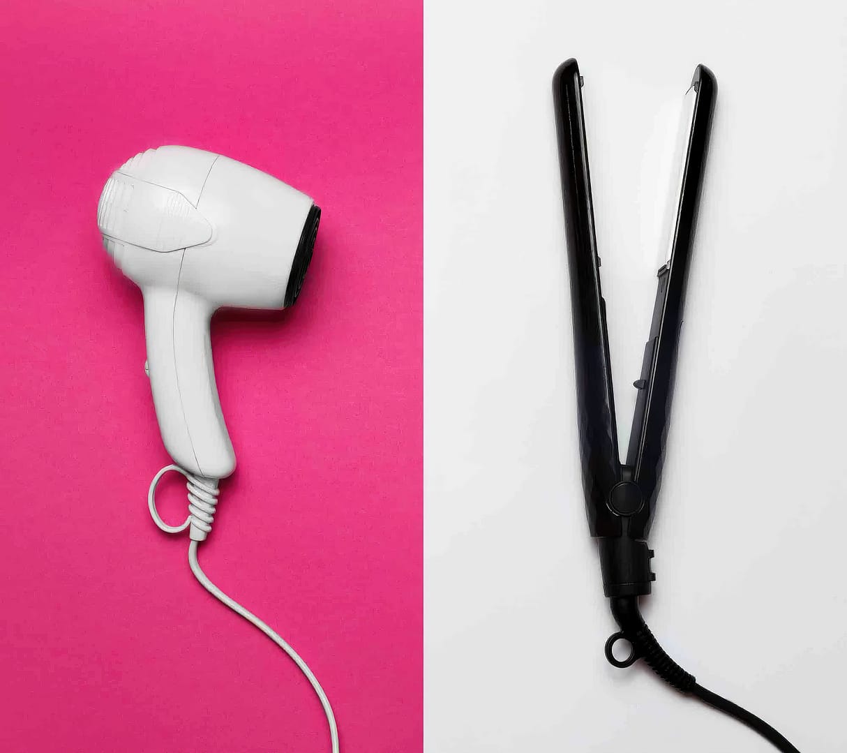 A white hair blow dryer and a black styling iron