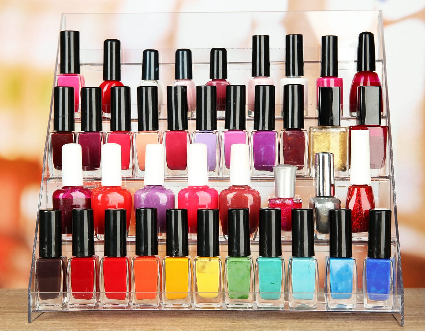 Various bright nail polishes on shelf