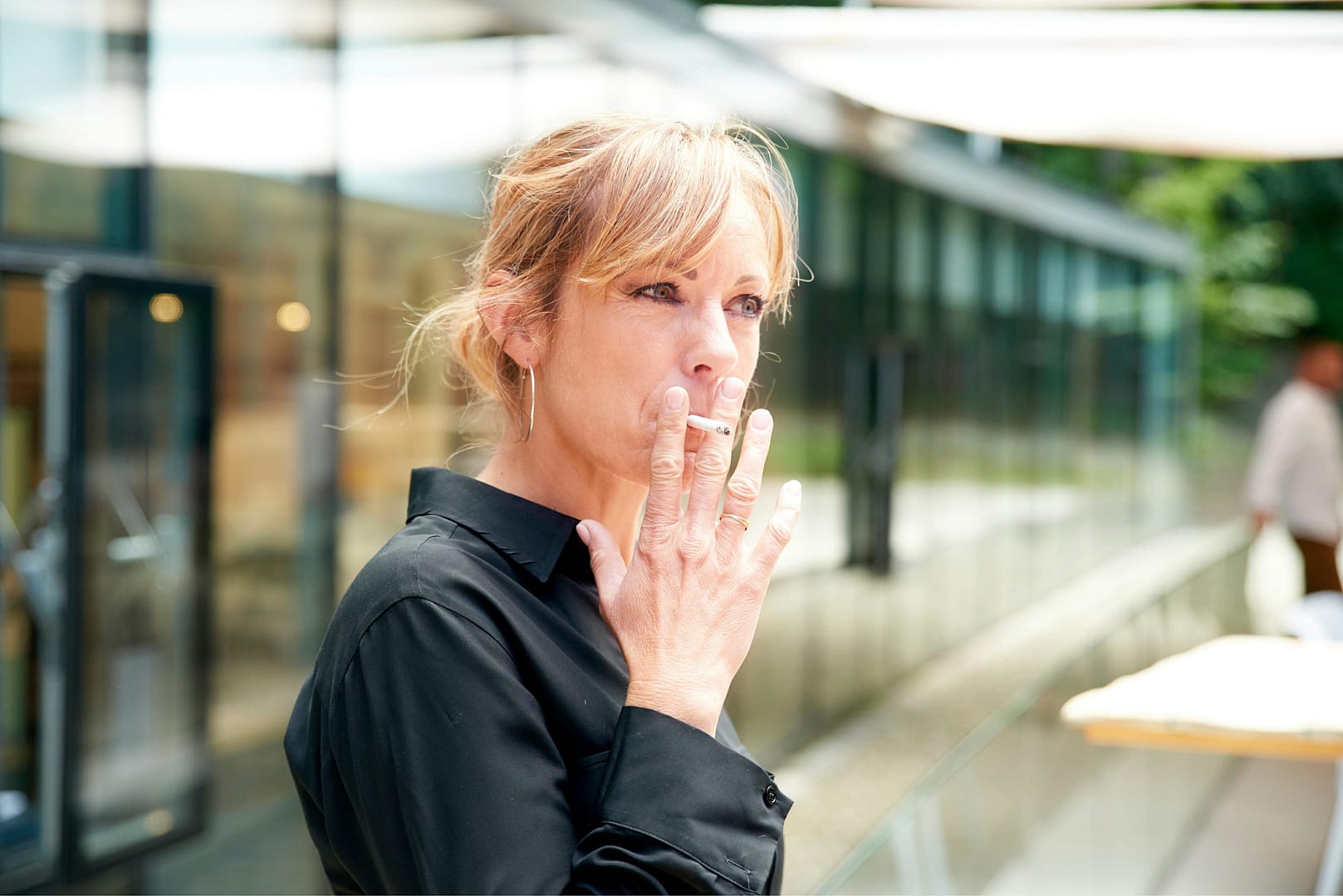 Middle aged woman smoking cigarette