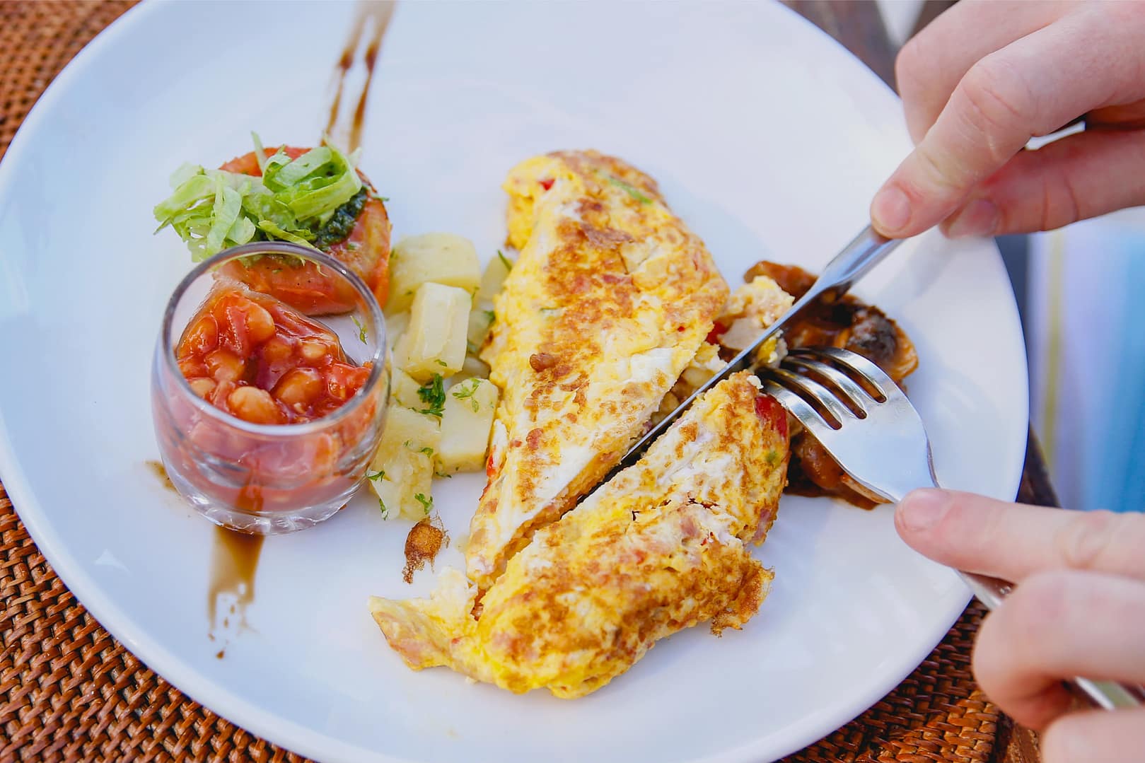 Closeup of a woman's hands eating high protein foods
