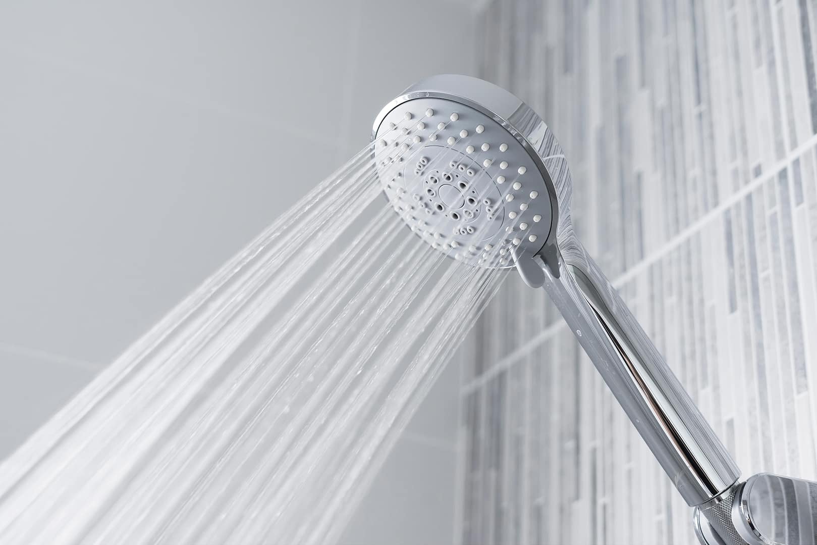 Bathroom shower head spraying water