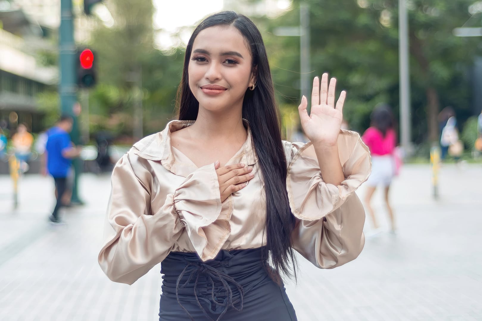 A beautiful Filipino woman swears loyalty, promising to speak the truth, or takes an oath