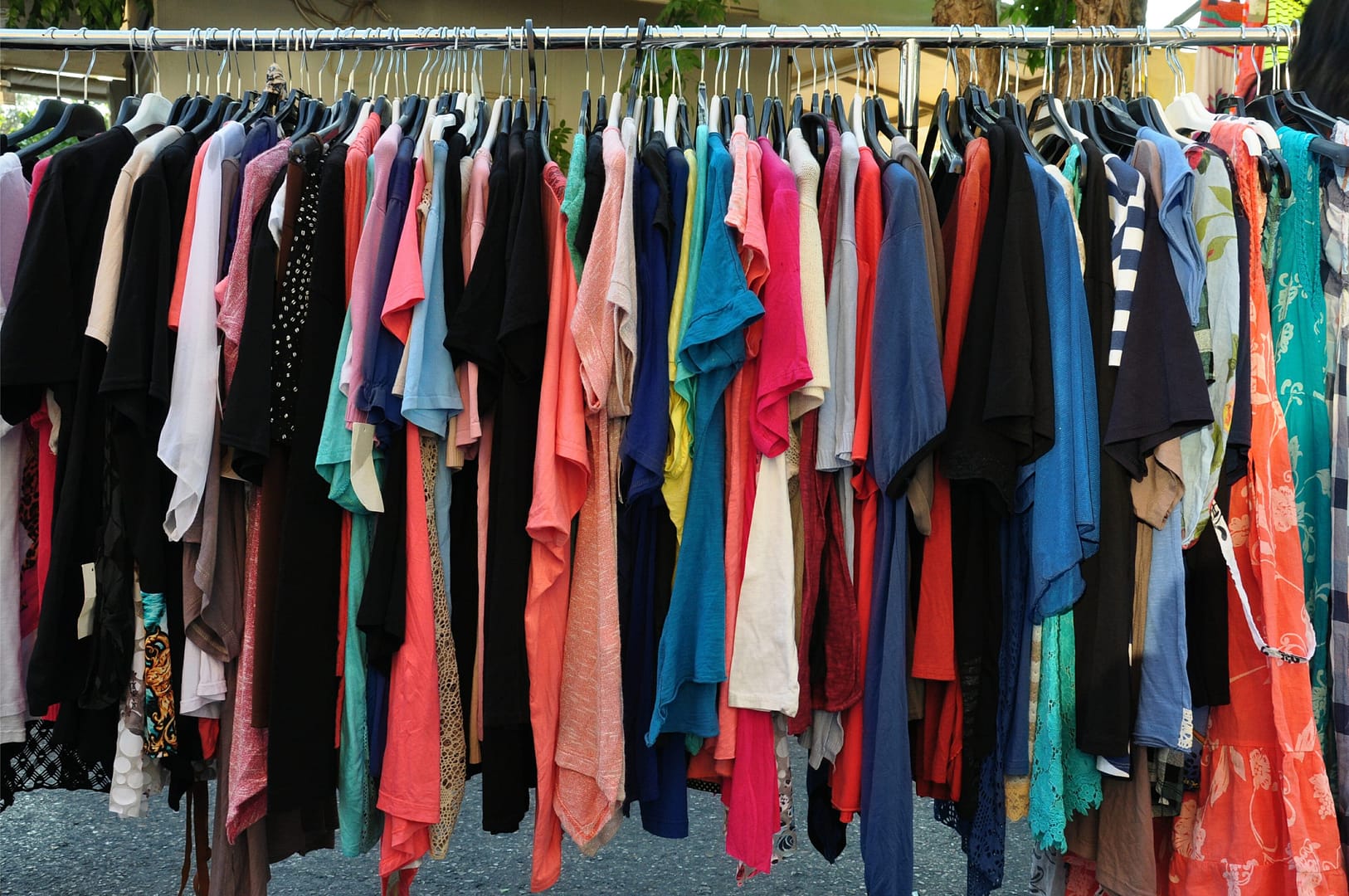 Casual summer clothes on hangers