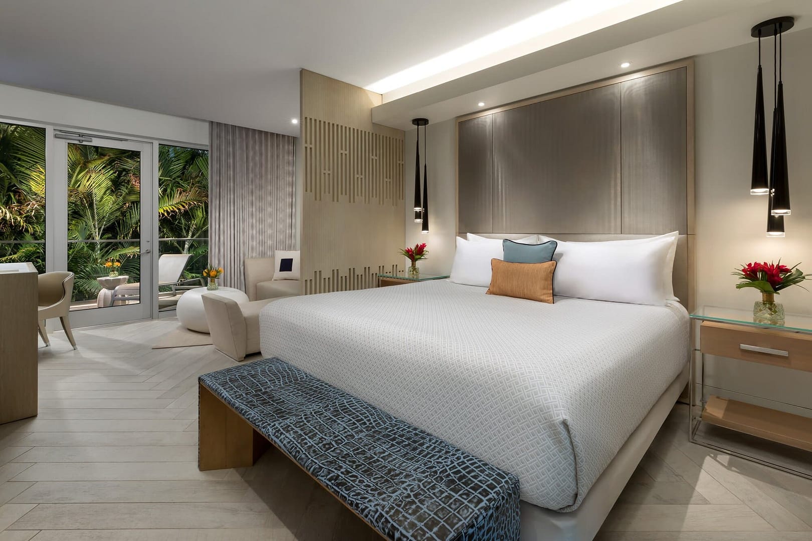 Bedroom and lounge area at H2O Suites Hotel