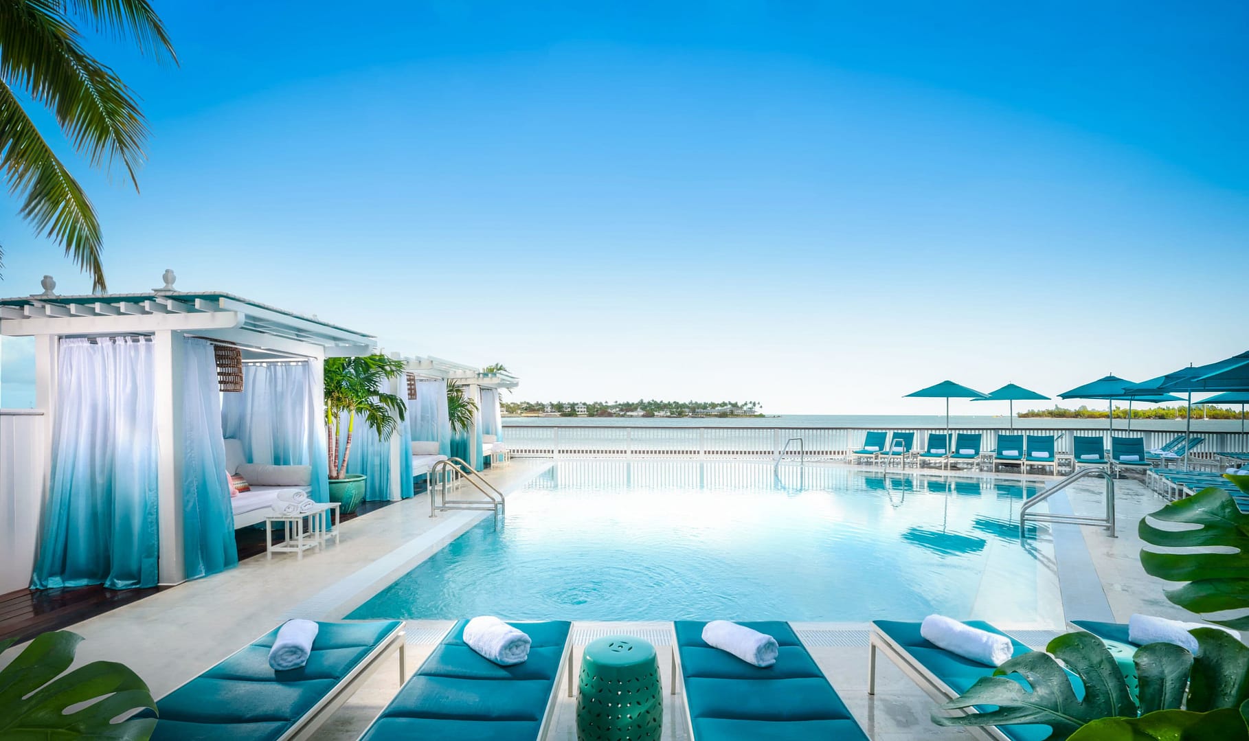Outdoor pool, sun loungers at Ocean Key Resort & Spa, A Noble House Resort
