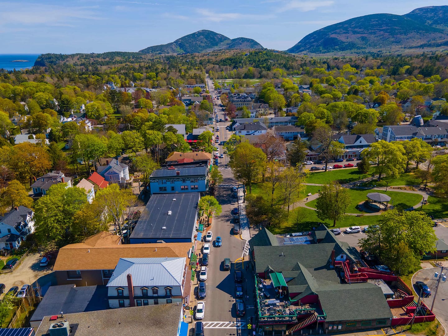 Bar Harbor historic town center aerial view on Main Street with Cadillac Mountain in Acadia National Park at the background, Bar Harbor, Maine, USA