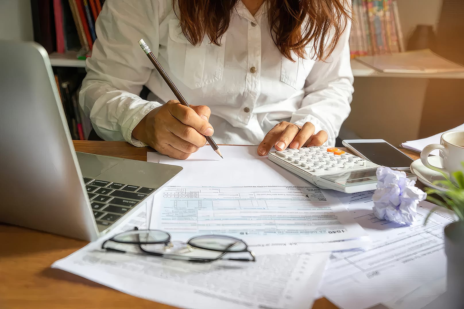 Woman writing on a paper for her travel preparation