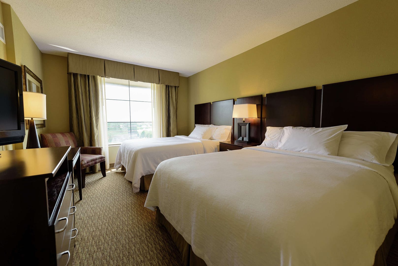 Bedroom view of Embassy Suites by Hilton Minneapolis North