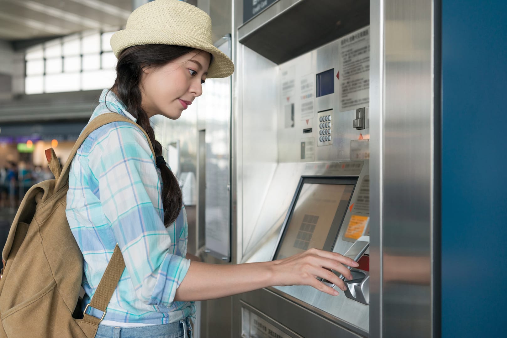 Young woman traveler using smartphone wallet to pay