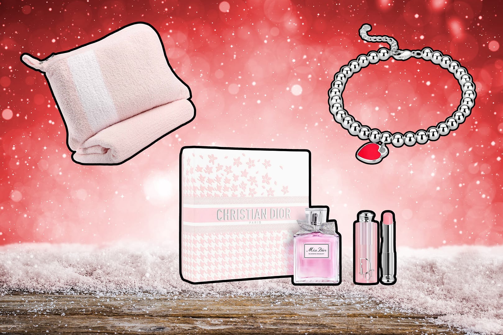 A pink travel blanket, a silver bracelet with a red heart charm, and a Dior gift set with perfume and lipstick rest elegantly on a snowy red background—truly some of the best Valentine’s Day gifts for her