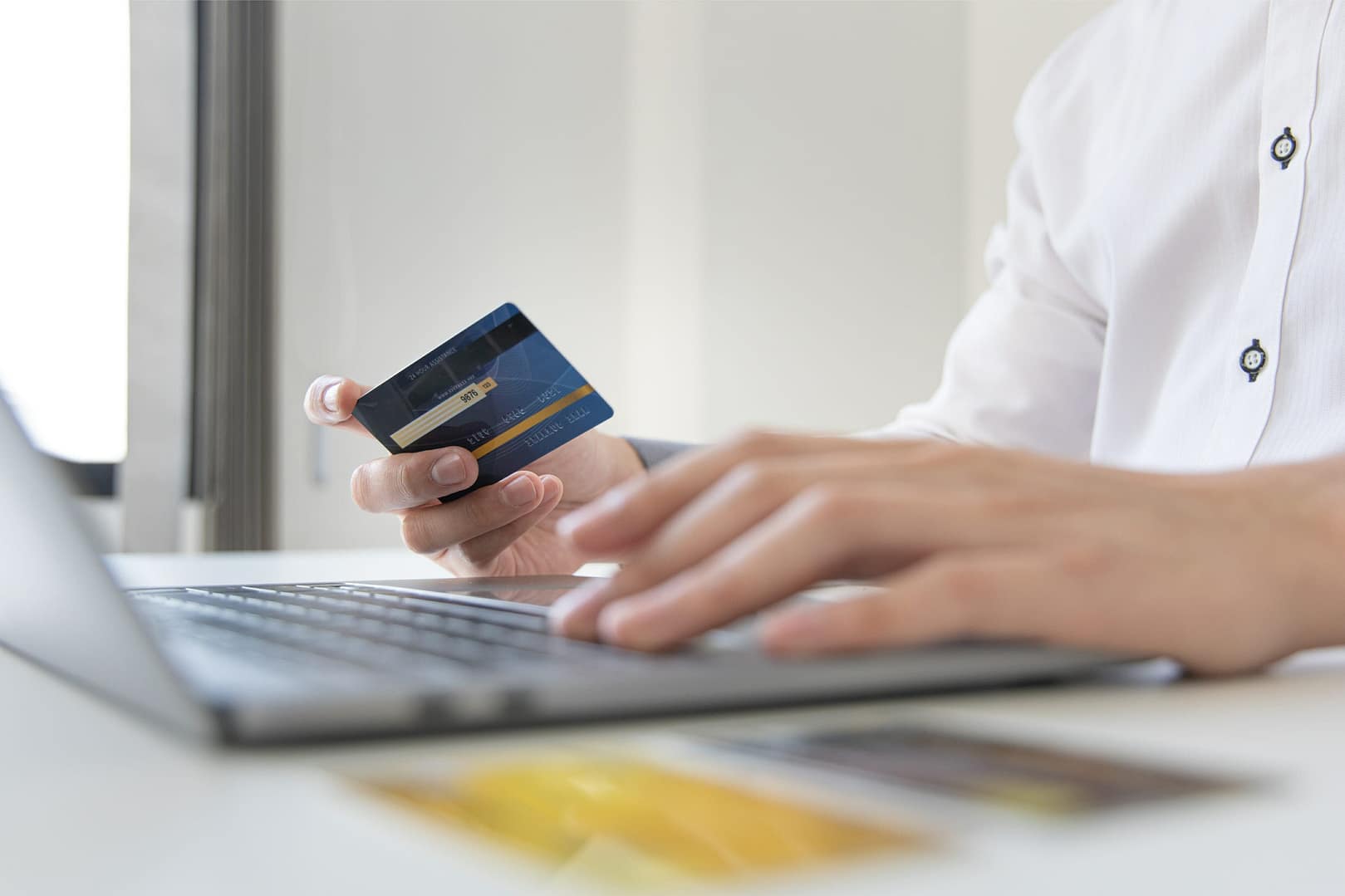 Online product purchase, Businessmen use laptops to register via credit cards to make online purchases