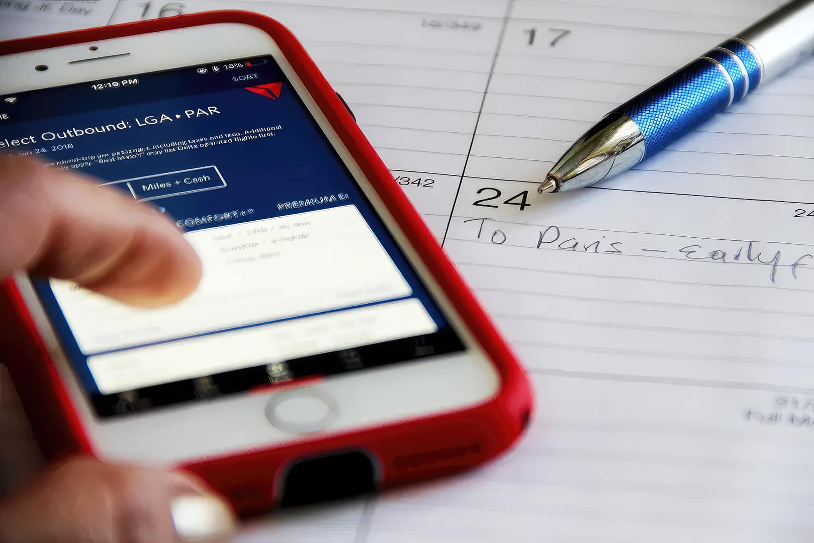 A person finding cheap flights of the day on a smartphone