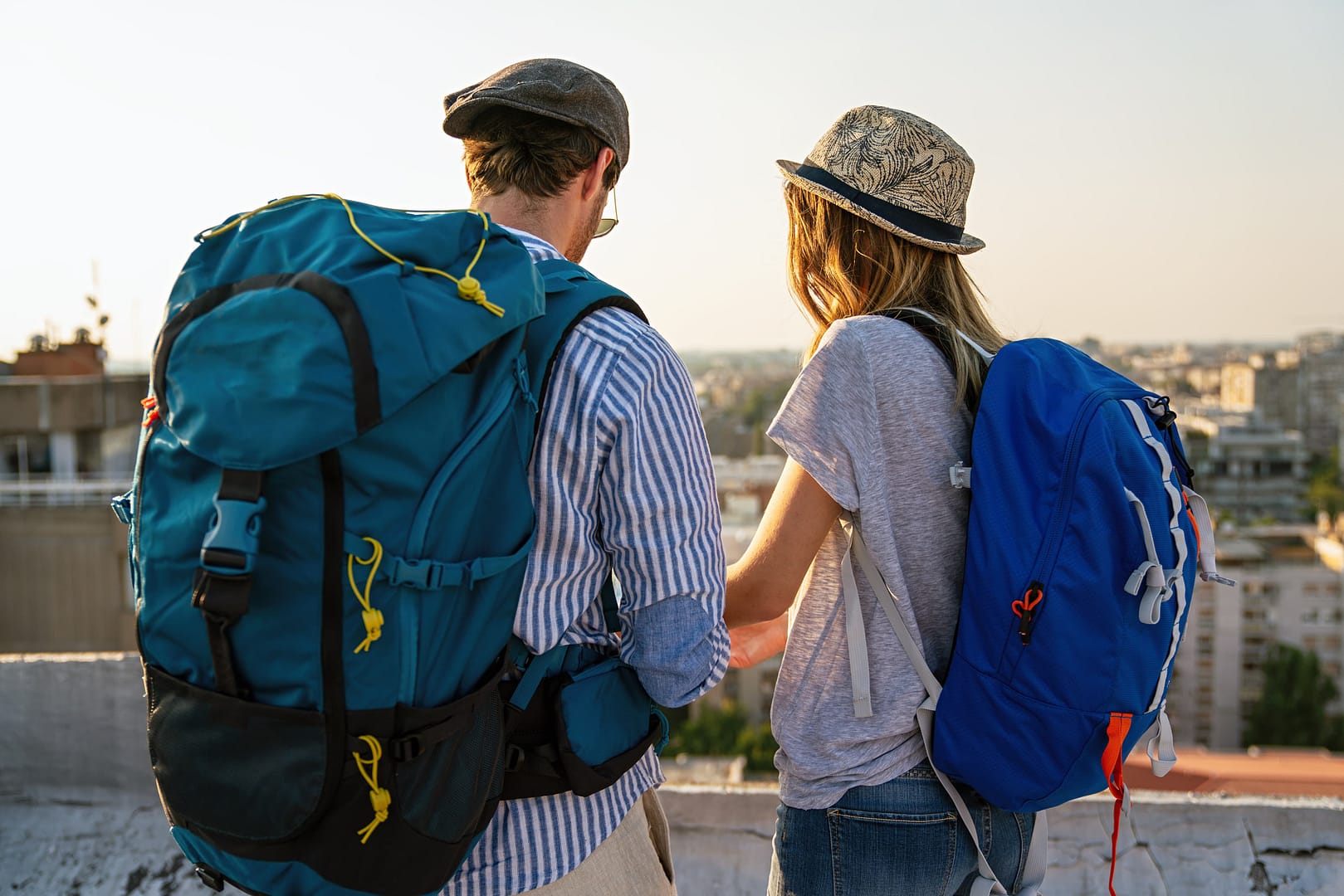 Happy couple on vacation sightseeing city with map. People travel fun honeymoon concept