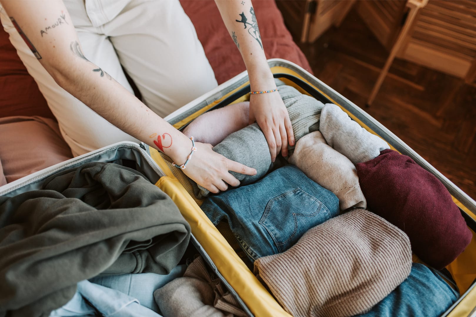 Person packing a luggage