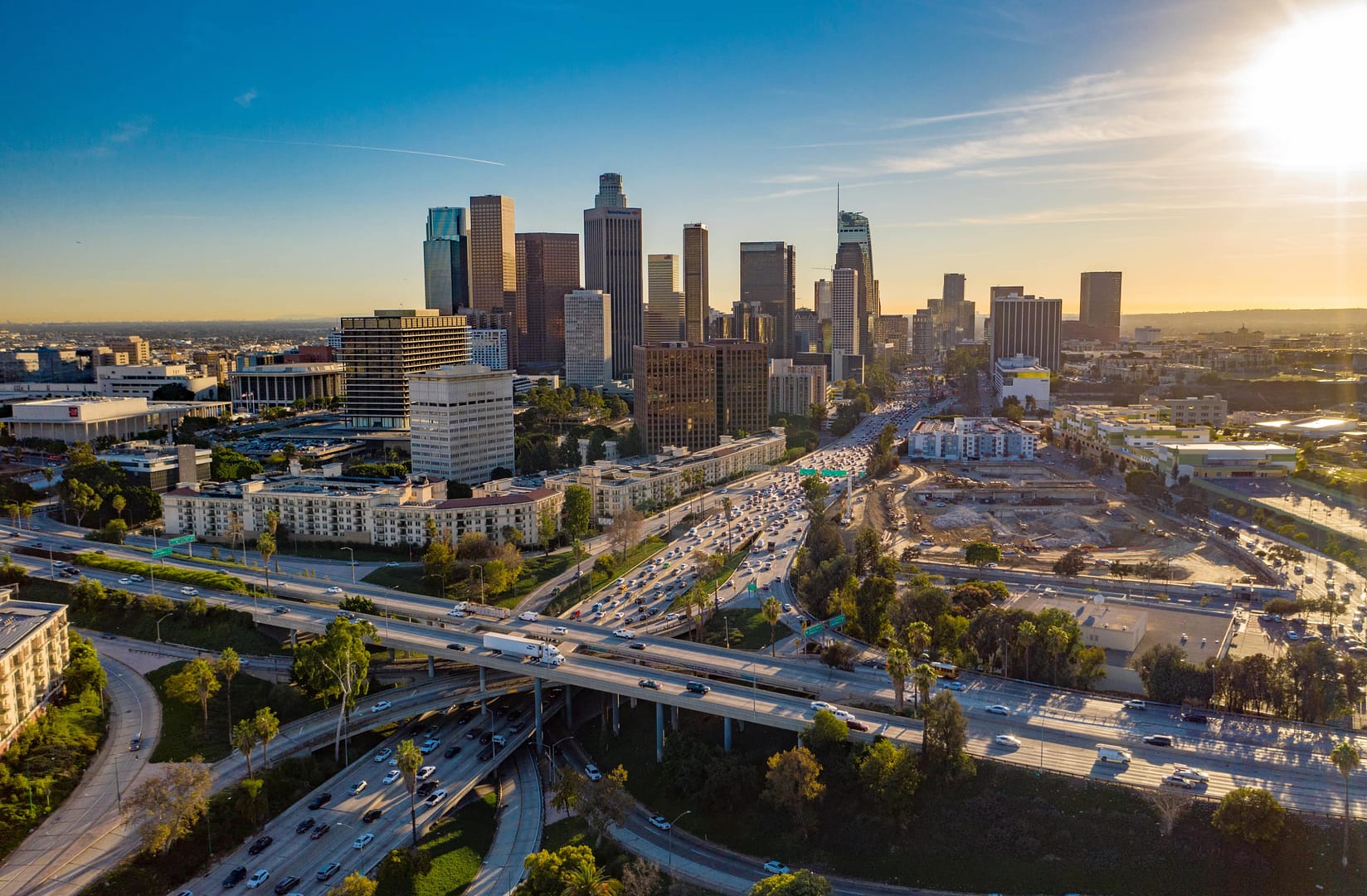 Aerial view of downtown Los Angeles or LA skyline with skyscrapers and freeway traffic below