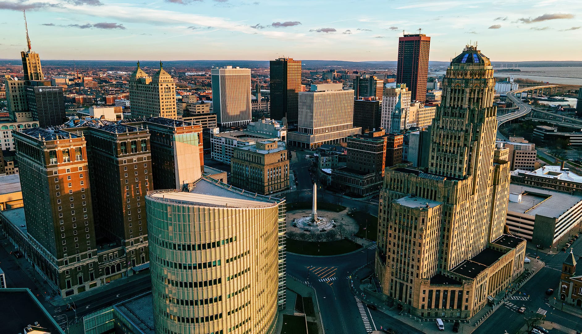 City skyline from above, showcasing towering skyscrapers, bustling streets, and a vibrant urban landscape