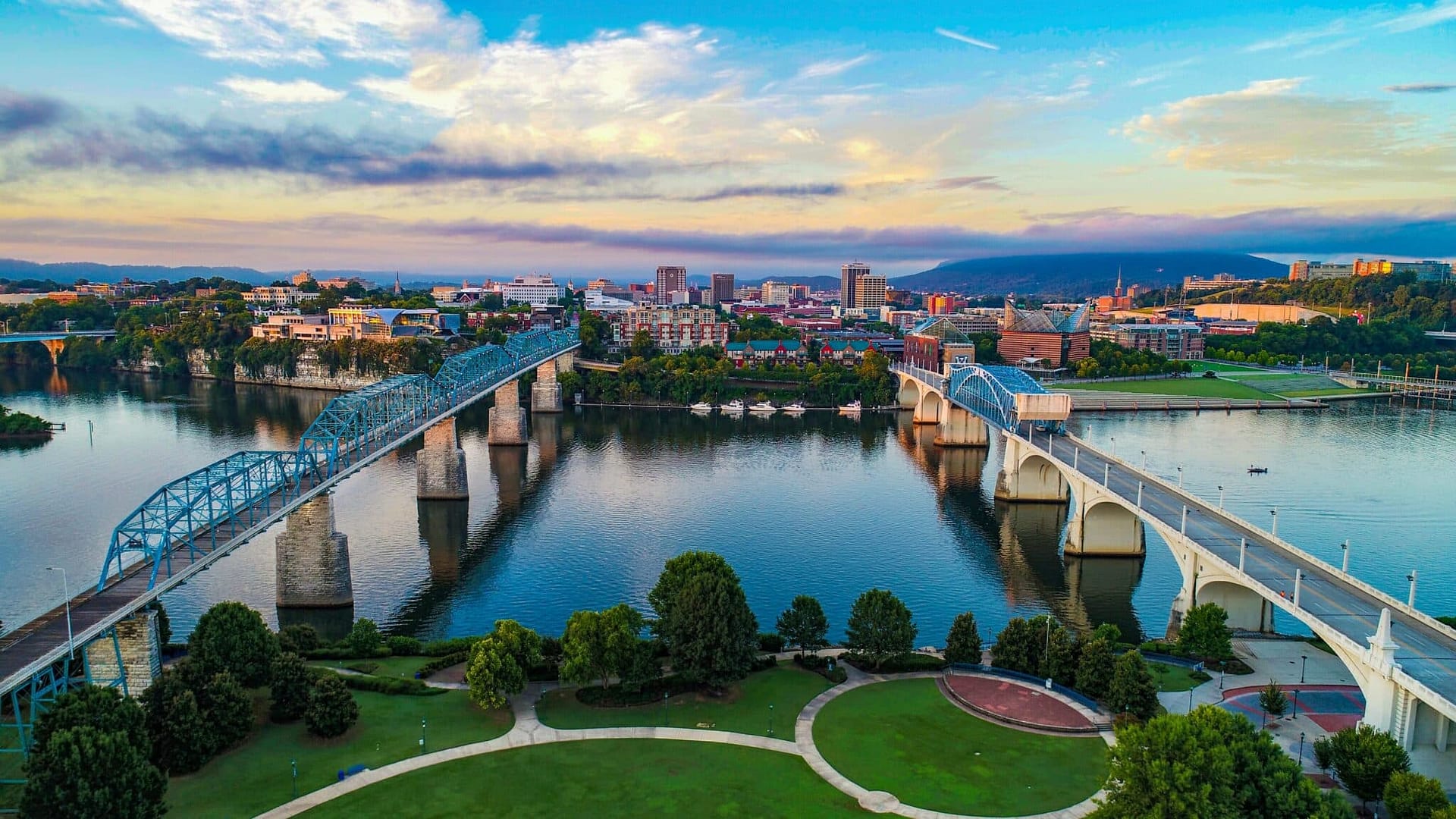 A bird's-eye view of a bridge spanning over a river, captured from above