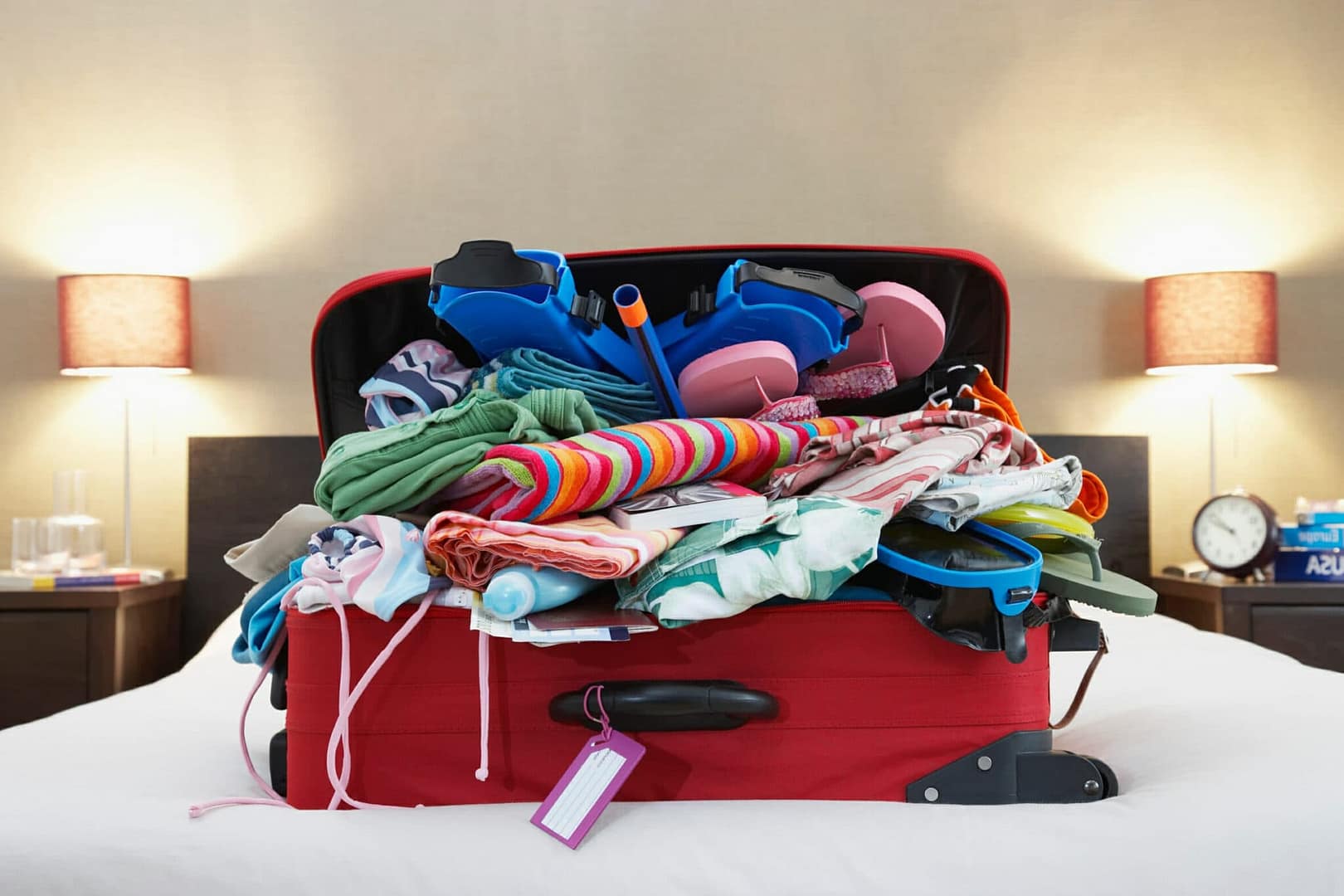 Open suitcase on bed