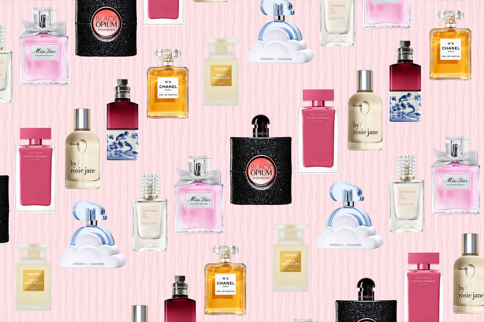 A selection of the best perfumes for women, featuring various bottles from different brands, arranged in a scattered pattern on a light pink striped background
