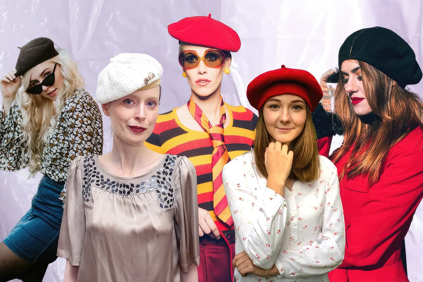 Five women are wearing various styles of berets in different colors; the background appears to be a pale purple, textured surface