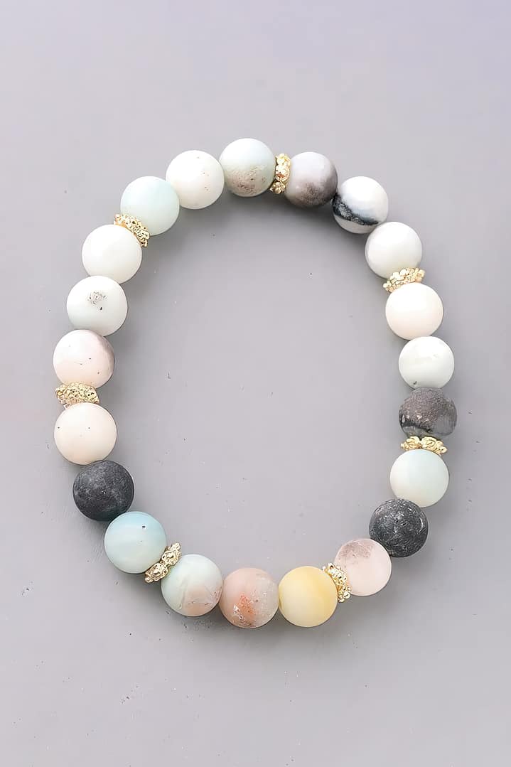 A bracelet made of white, grey, and black stones