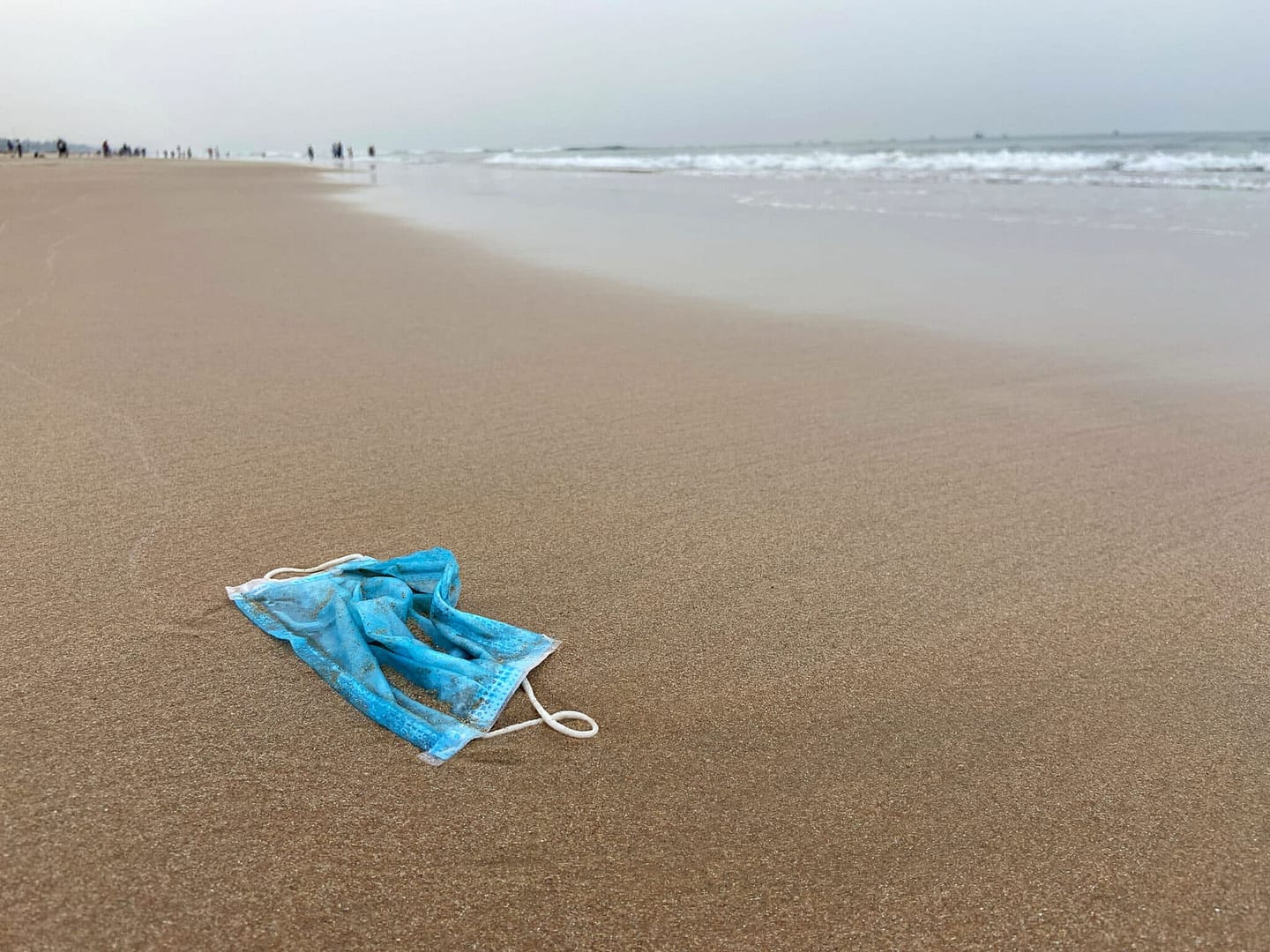 Mask discarded on beach in an inappropriate way at Baga beach Goa, India