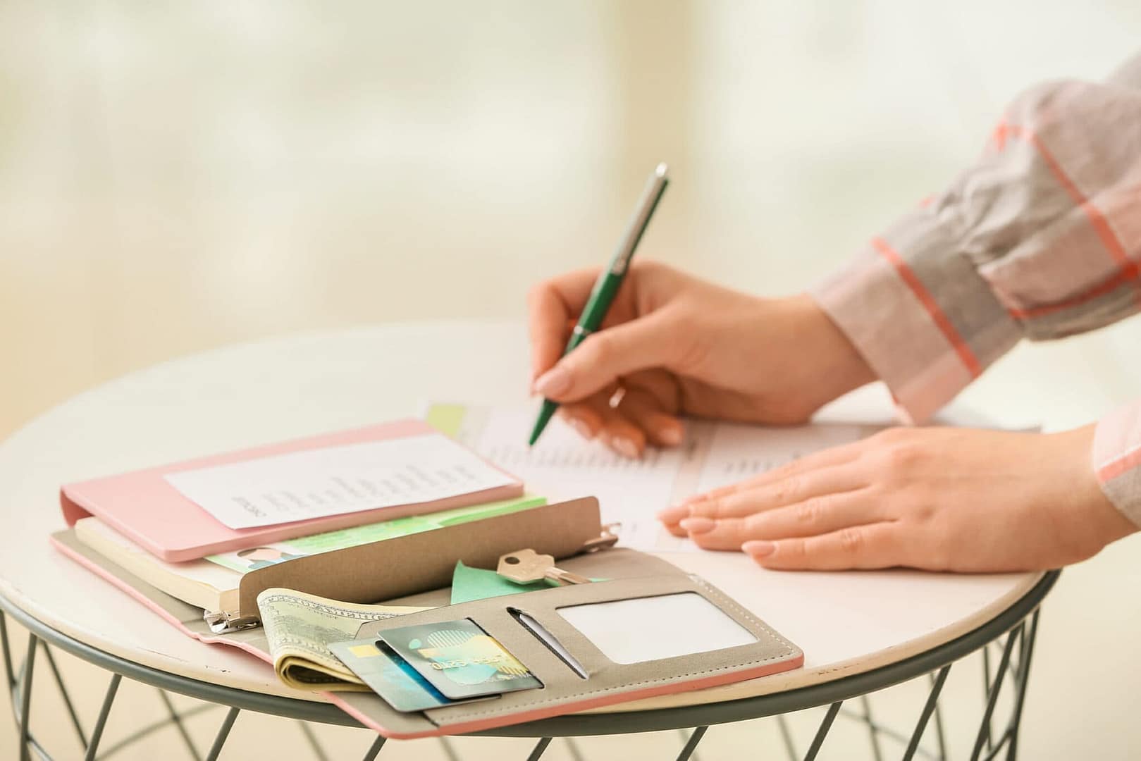 Woman with travel organizer at table