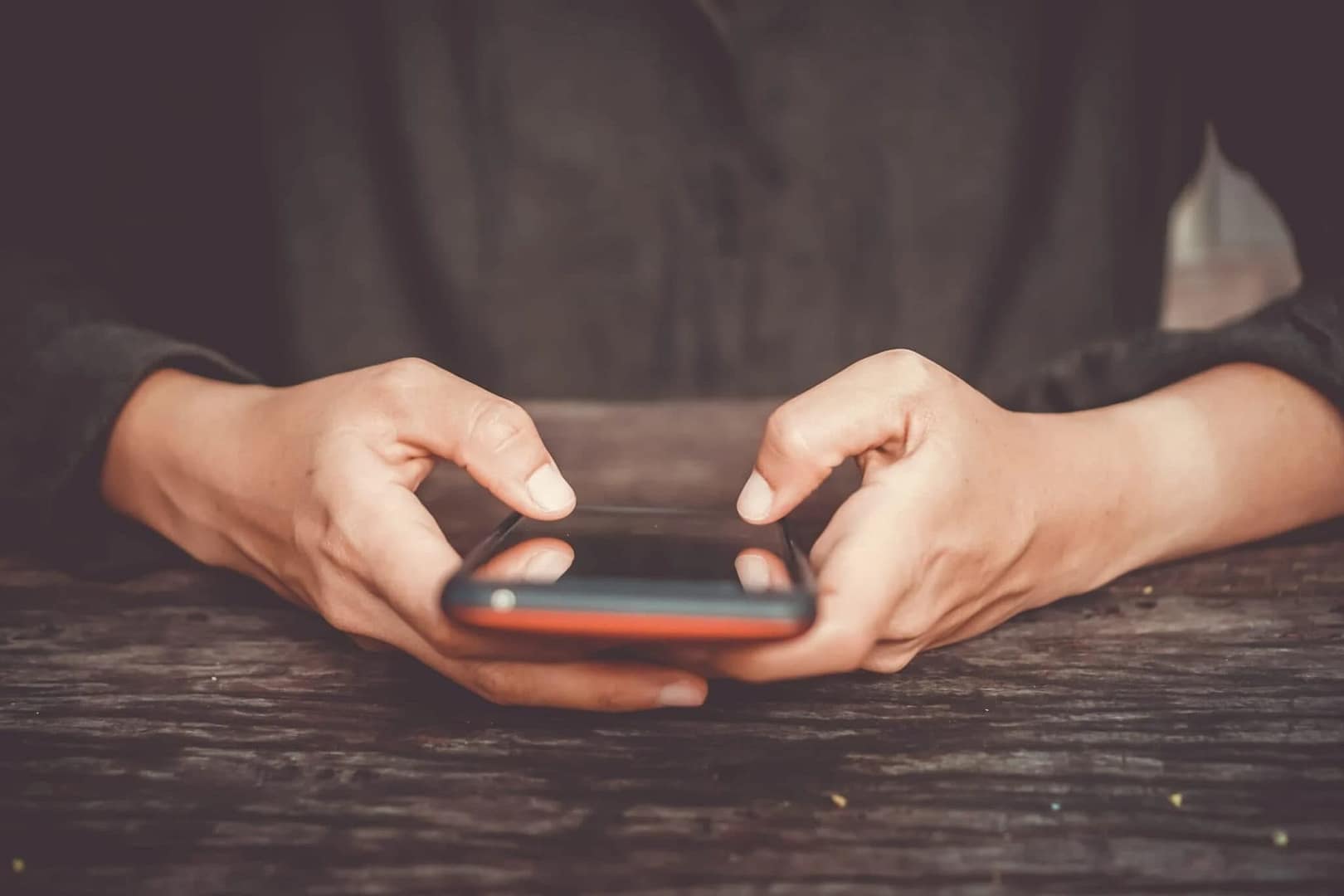 Woman hand using smartphone or tablet to do business