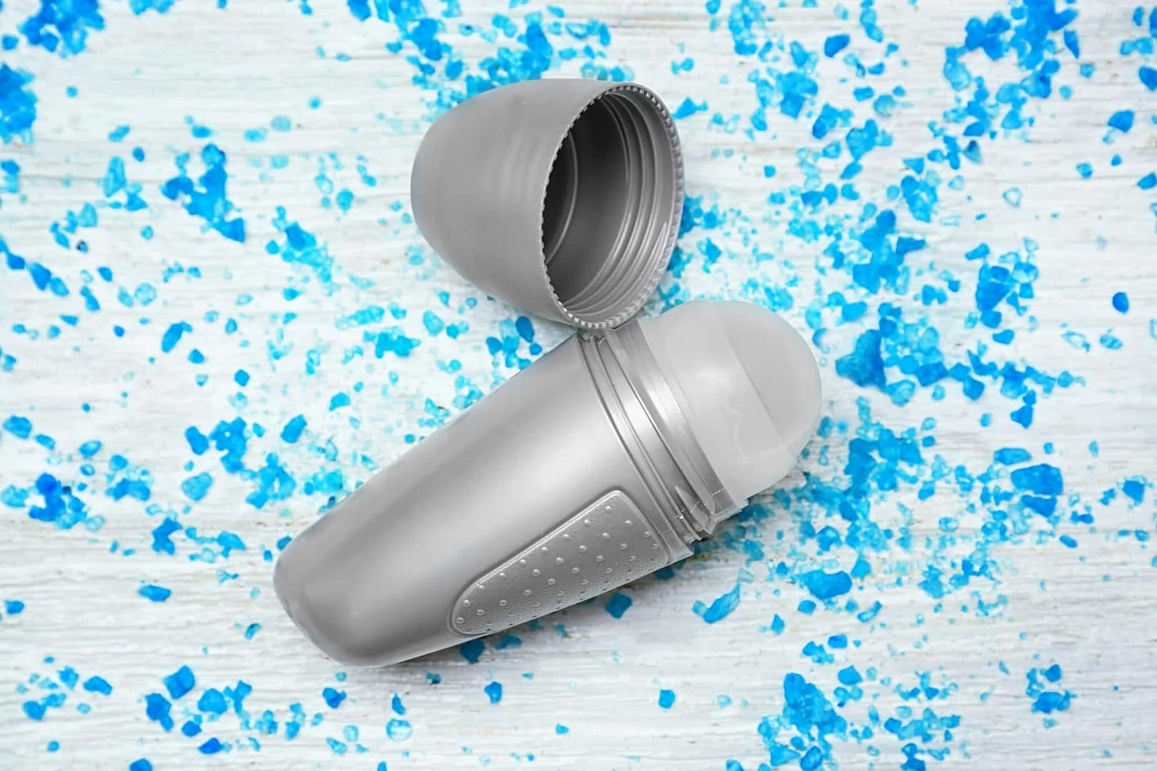 Deodorant with a silver and blue exterior and a matching plastic lid