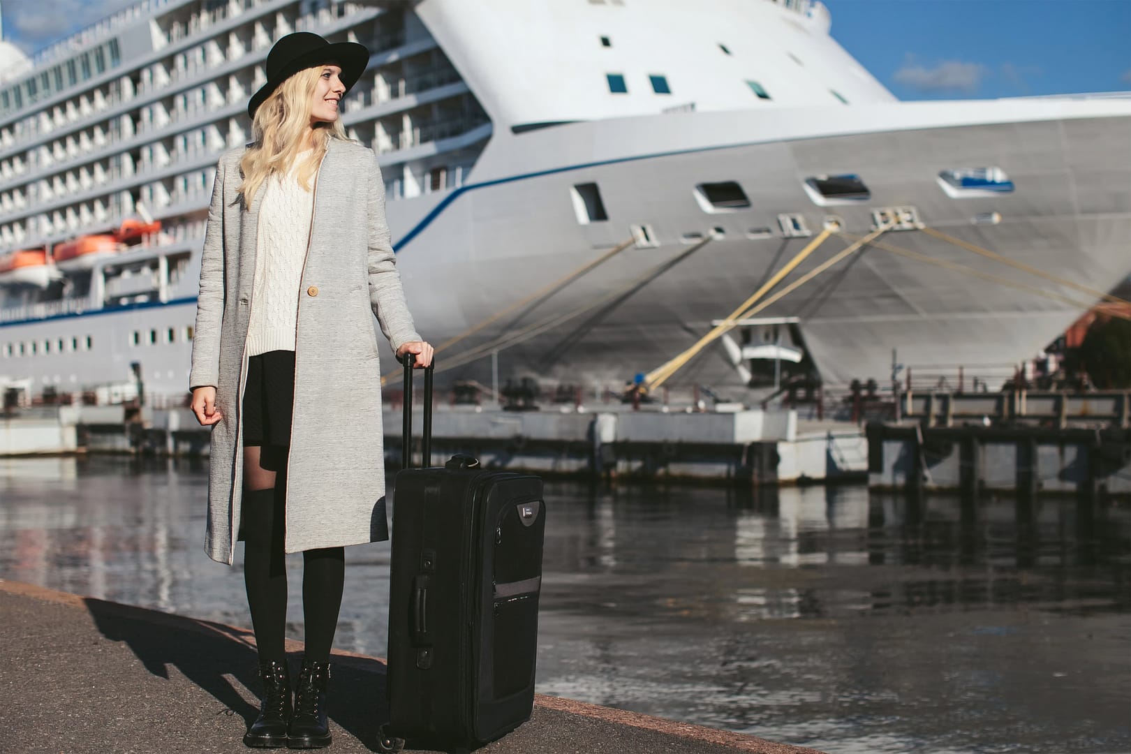 Solo female traveler ready to board a cruise ship